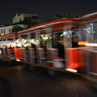 Happy train in the streets of Plaka, the old town of Athens, Greece