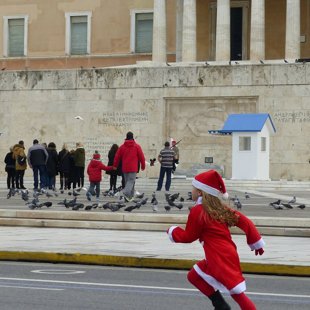 girl runner at the annual Athens Santa run in front of the Greek Parliament - 2016