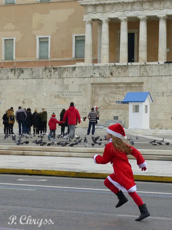 girl runner at the annual Athens Santa run in front of the Greek Parliament - 2016
